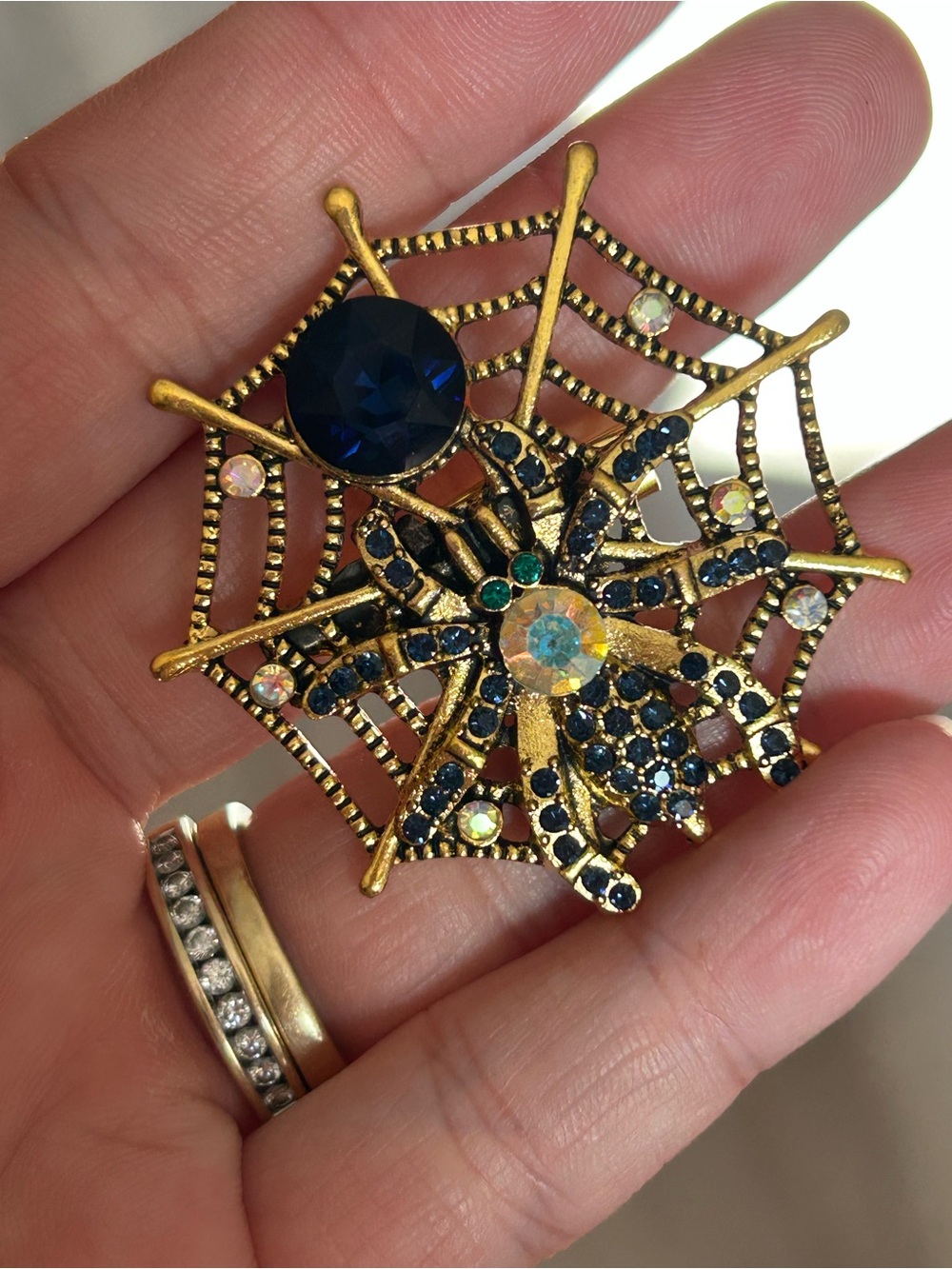 4/$50 Gold-Tone Spider Web Brooch with Blue and Iridescent Stones